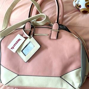 Cute bag has a shoulder strap as well